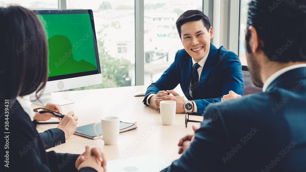 Business people in the conference room with green screen chroma key TV or computer on the office tab