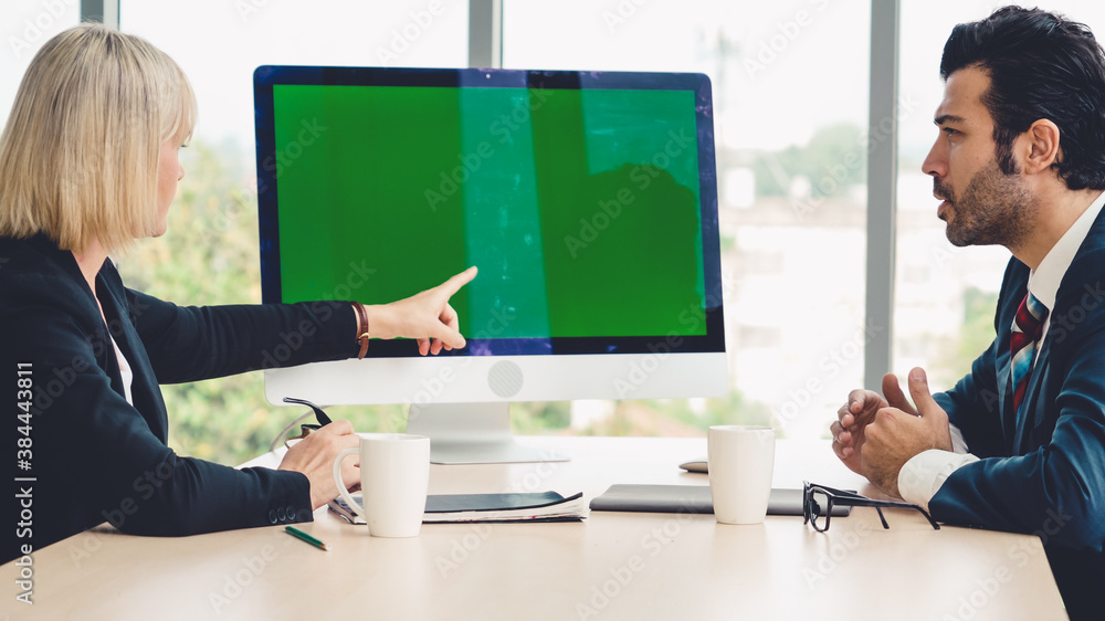 Business people in the conference room with green screen chroma key TV or computer on the office tab