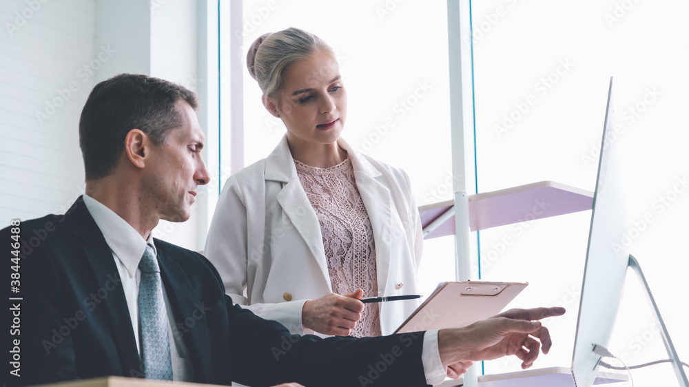 Two business people talk project strategy at office meeting room. Businessman discuss project planni