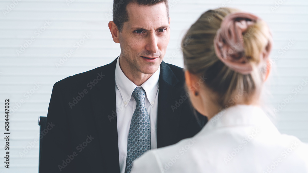 Job seeker in job interview meeting with manager and interviewer at corporate office. The young inte