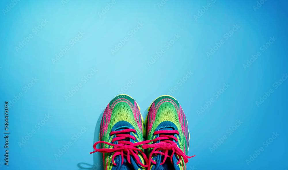 Pair of sport shoes with pink laces - flat lay