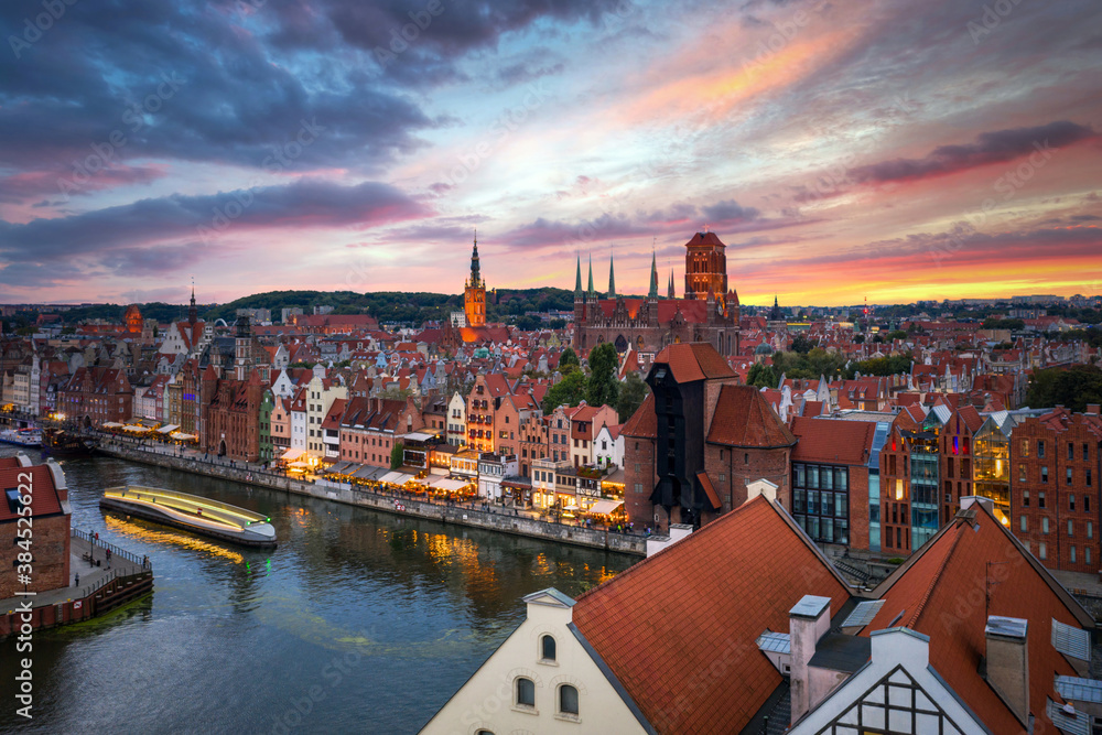 Aerial view of the Gdansk city over Motlawa river with amazing architecture at sunset,  Poland