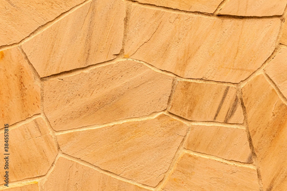 Brown stone cladding wall pattern and texture background