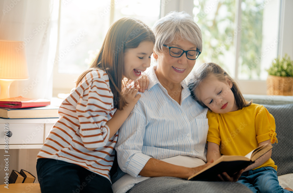 girls and their grandmother enjoying sunny morning