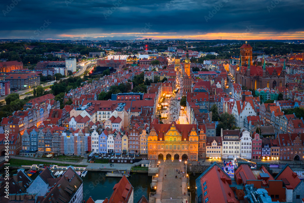 Beautiful sunset over the old town of Gdansk with City Hall and St. Mary Basilica, Poland