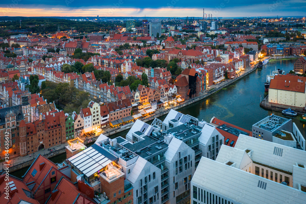 Aerial view of the Gdansk city over Motlawa river with amazing architecture at sunset,  Poland