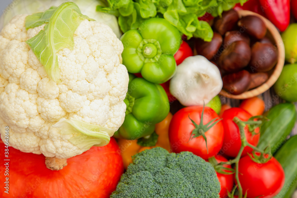 Group vegetables and Fruits Apples, grapes, oranges, and bananas in the wooden basket with carrots, 