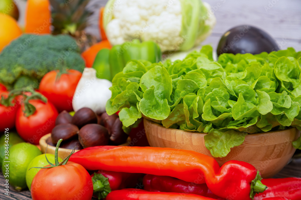 Group vegetables and Fruits Apples, grapes, oranges, and bananas in the wooden basket with carrots, 