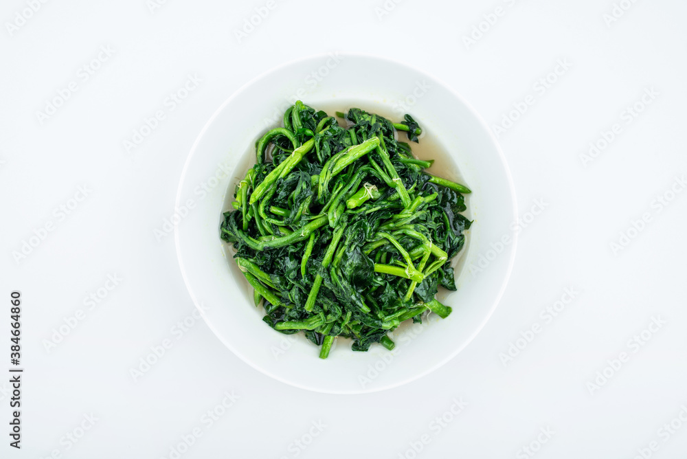 A dish of watercress on white background