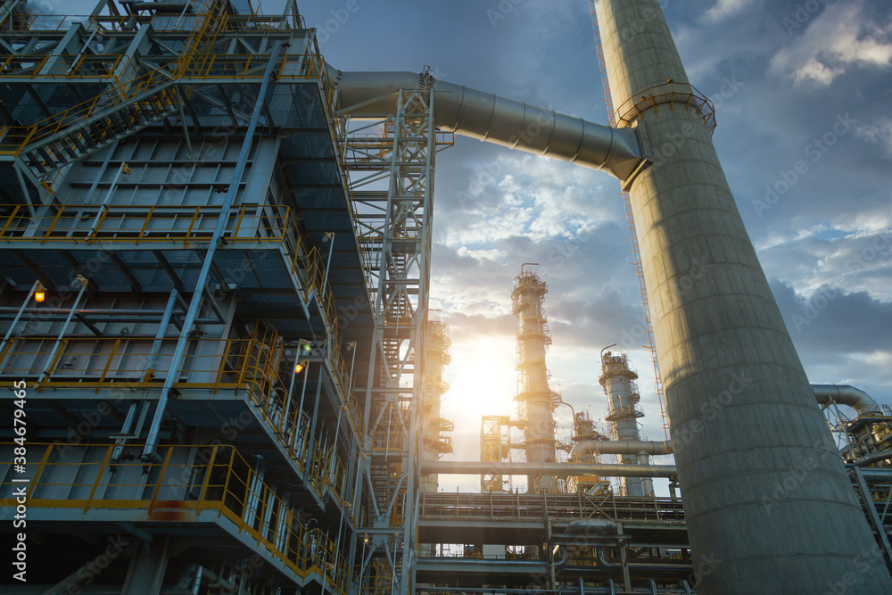 Close up Industrial view at oil and gas refinery plant form industry zone with sunrise and cloudy sk