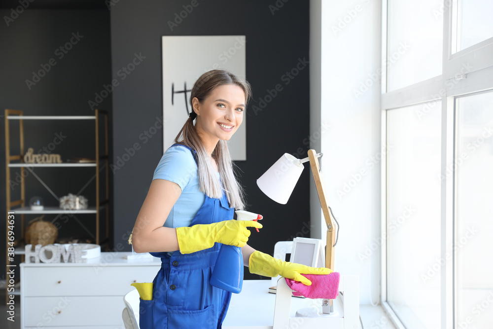 Young woman cleaning her flat