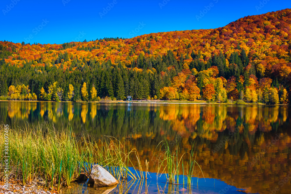 Beautiful autumn scenery with Saint Ana lake and colorful forest