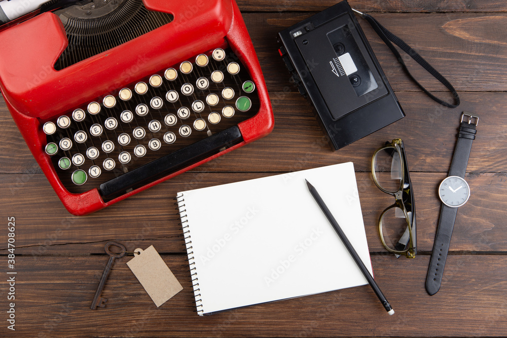 Journalism or blogging concept vintage typewriter on the wooden desk, top view