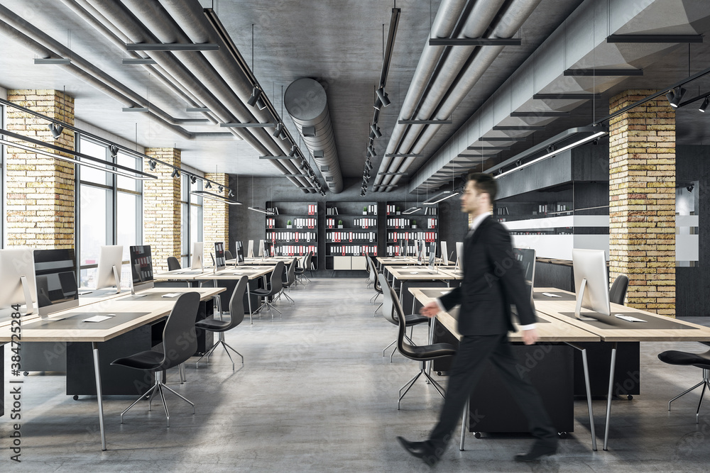 Businessman walking in modern coworking office