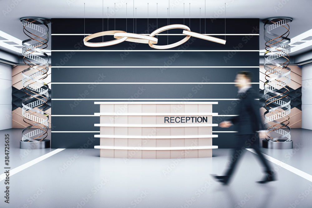 Businessman standing in modern hotel hall