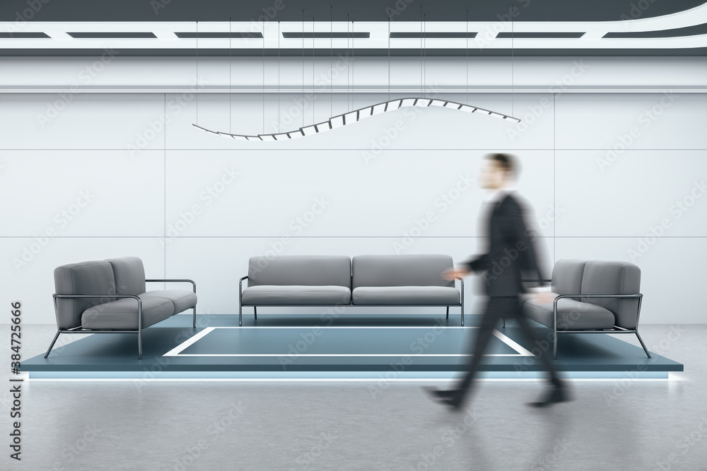 Businessman walking in modern waiting room