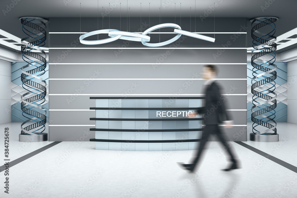 Businessman walking in futuristic hotel reception table