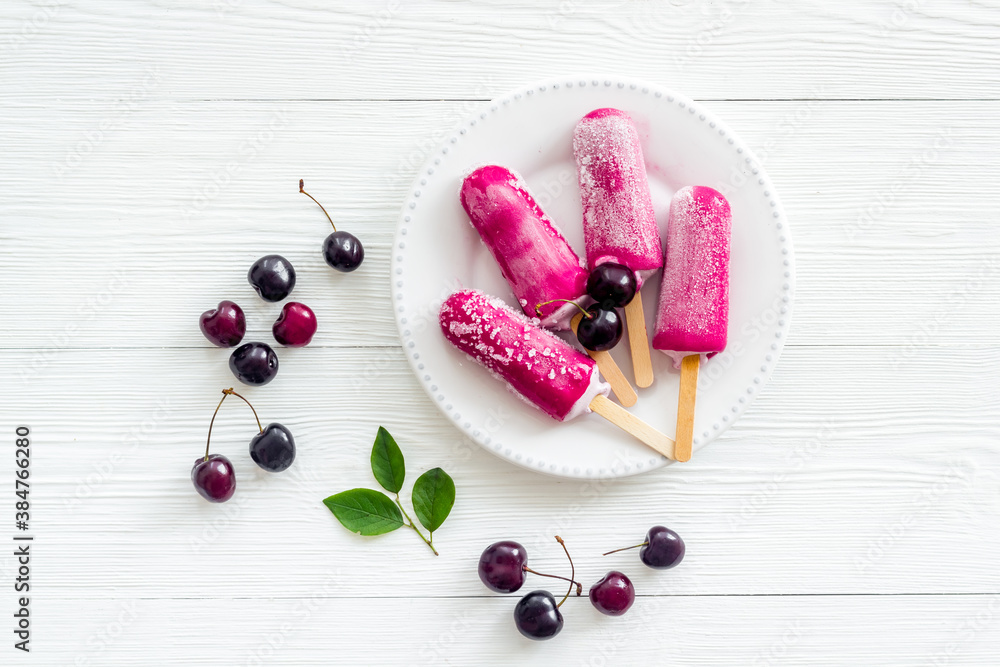 Cherry ice cream popsicles, top view, copy space