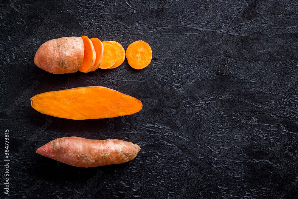 Pattern with sweet potato - yams. Organic vegetables background, overhead view