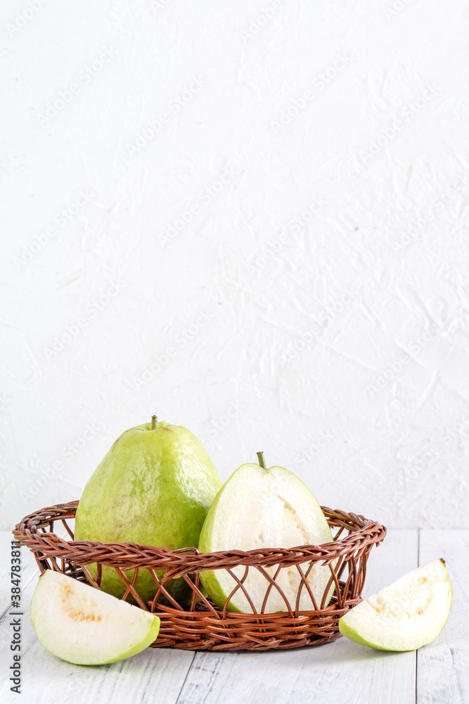 Delicious guava fruit set on white wooden table background with copy space.