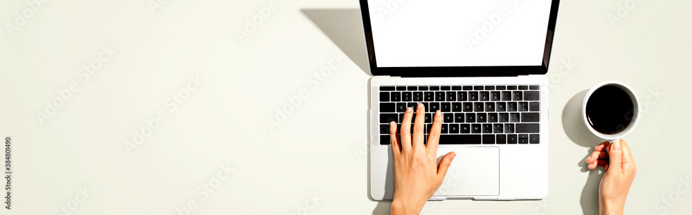 Person using a laptop computer from above