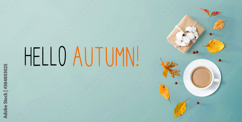 Hello autumn message with autumn theme with coffee and gift box