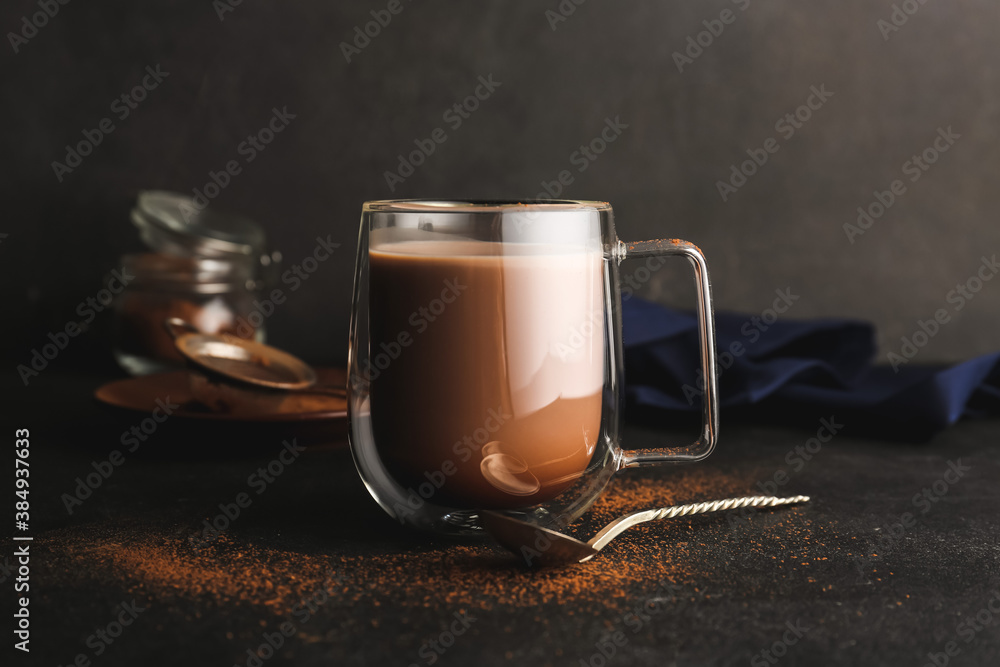 Glass cup of tasty cocoa drink on table