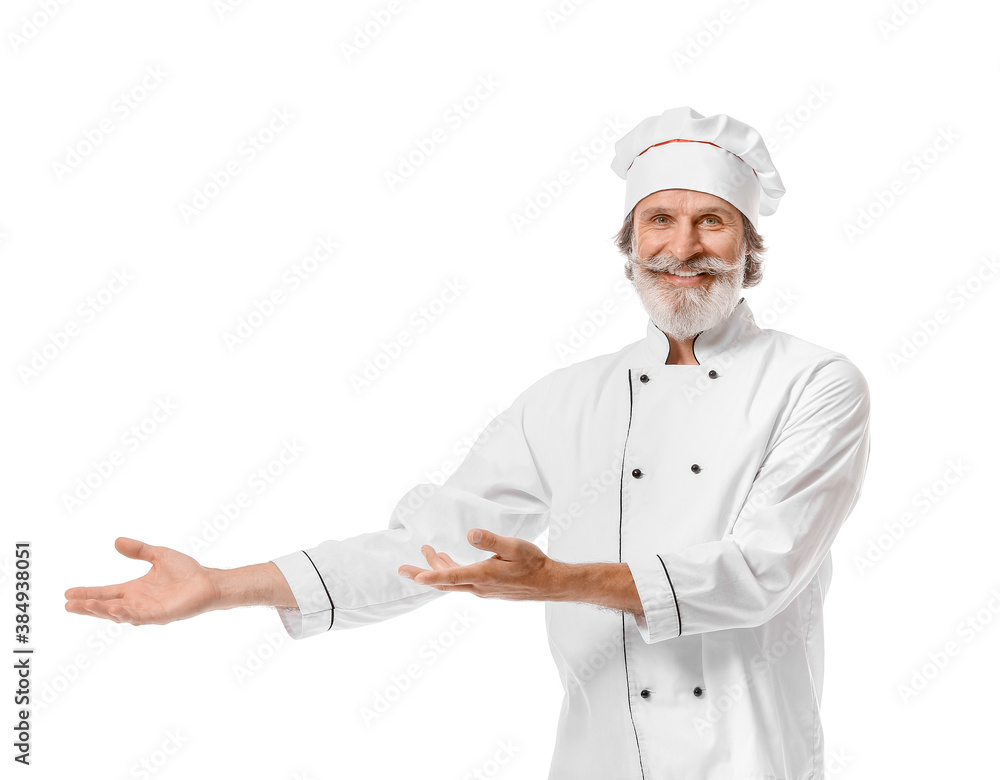 Mature male chef showing something on white background