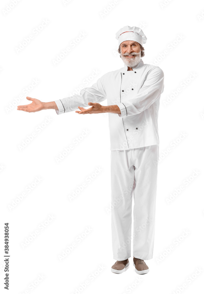 Mature male chef showing something on white background