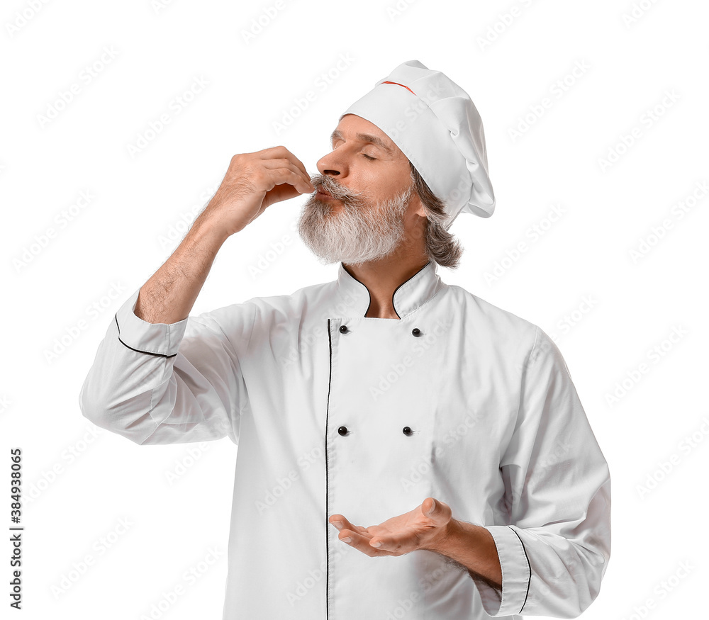 Mature male chef on white background