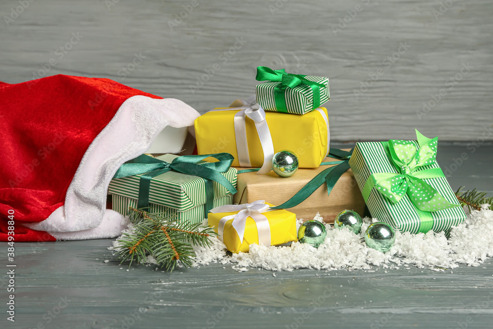 Santa bag with gifts on wooden background