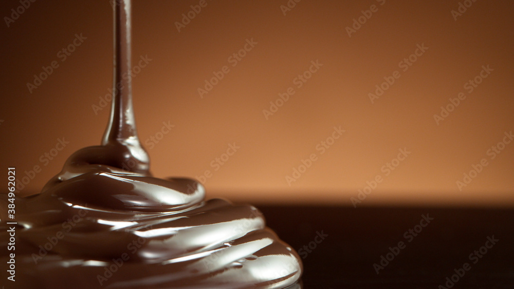 Detail of pouring hot chcocolate on table