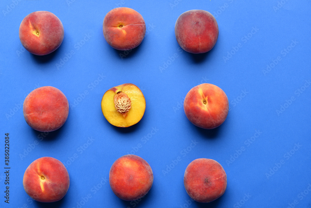 Sweet peaches on color background. Concept of uniqueness