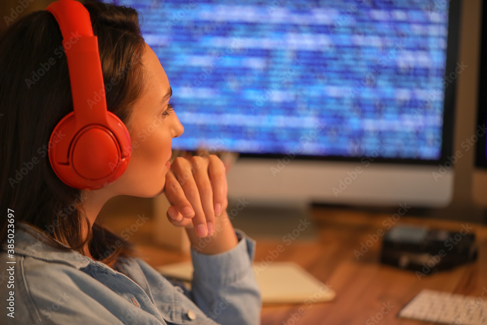 Female programmer working in office at night