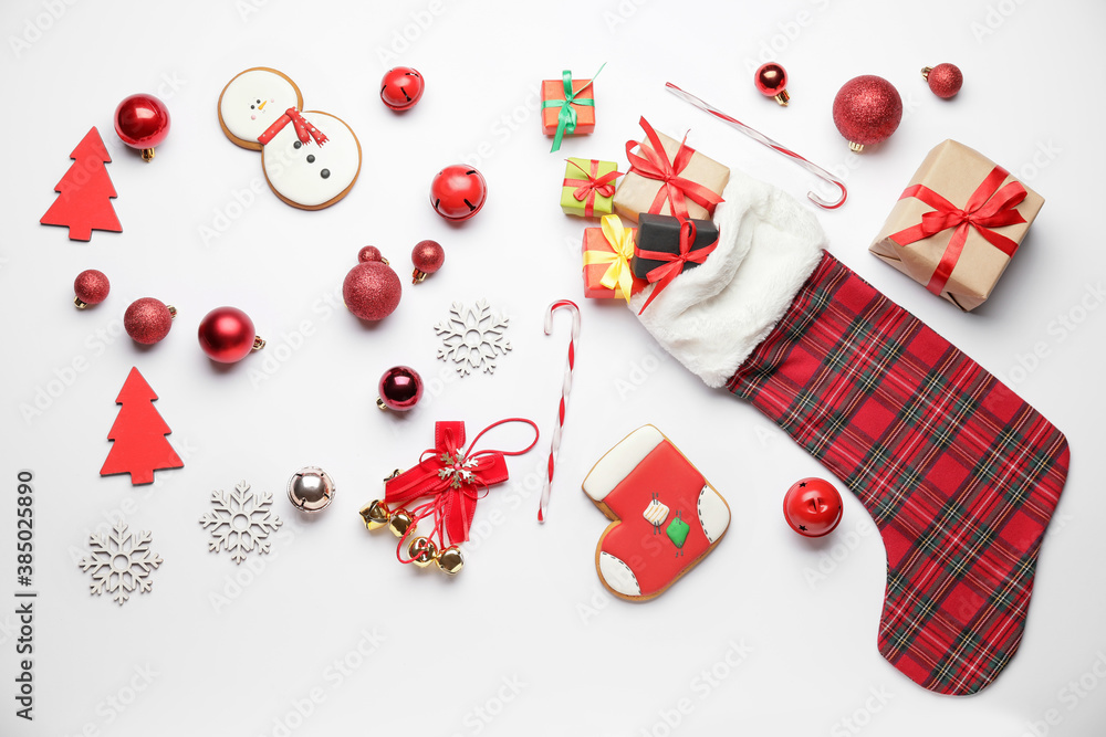 Composition with Christmas sock on white background