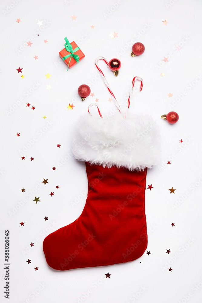 Christmas sock with decor on white background