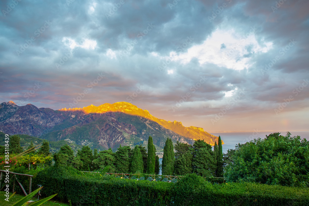 Wonderful views of Villa Cimbrone and other surrounding mountains. A ray of the sun hits and paints 