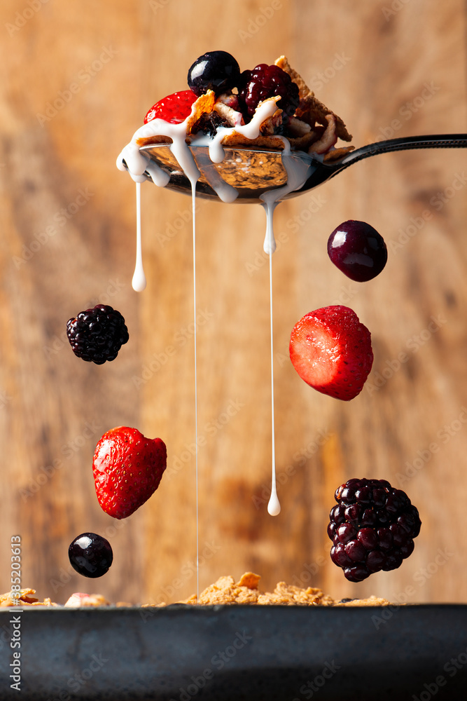 Breakfast cereal with pink lady apple, flame raisin fruit, flakes and clusters, food background.