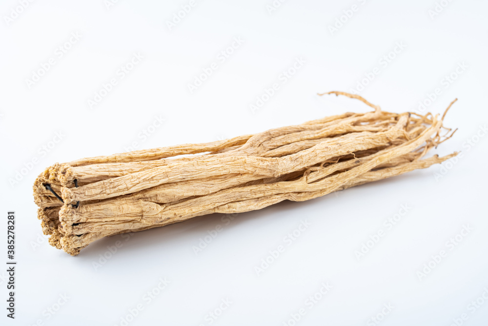 A handful of Chinese herbal medicine Codonopsis on white background