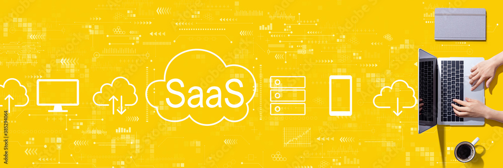 SaaS - software as a service concept with person using a laptop computer