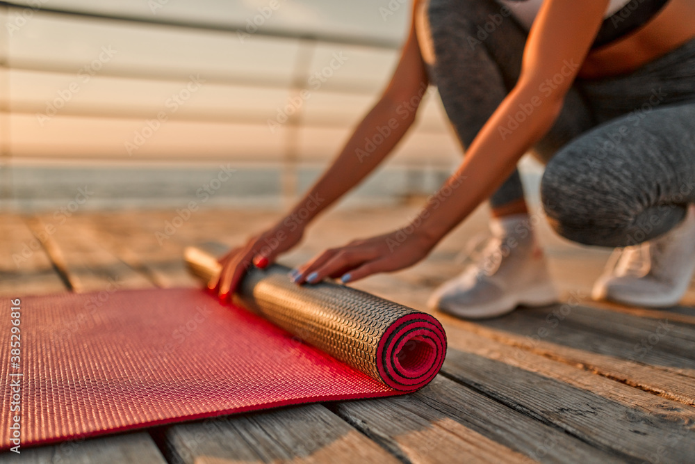 Girl doing yoga on sunrise