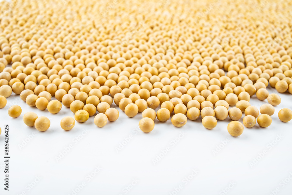 Golden soybeans on white background