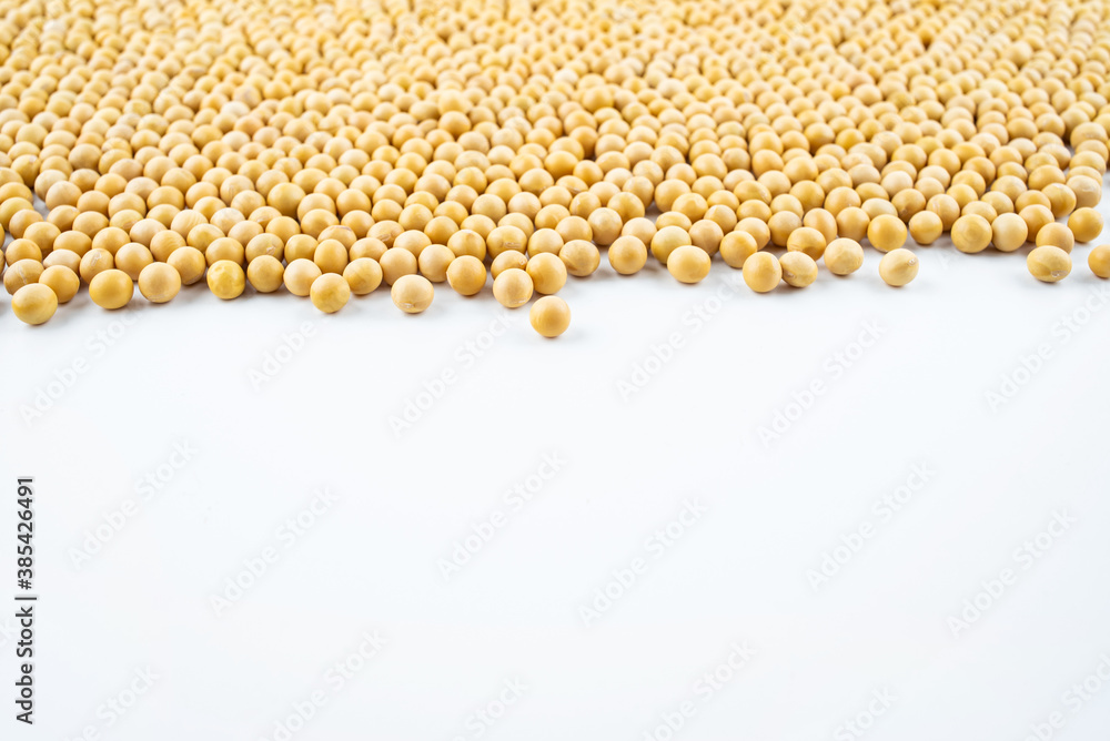 Golden soybeans on white background