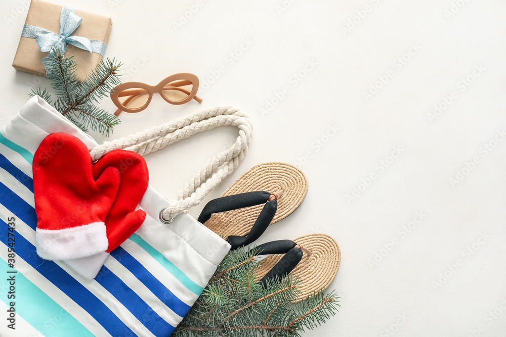 Composition with Christmas decor and beach accessories on white background