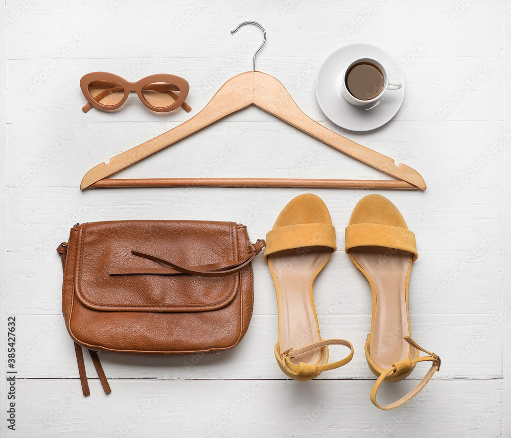 Clothes hanger and accessories on white background