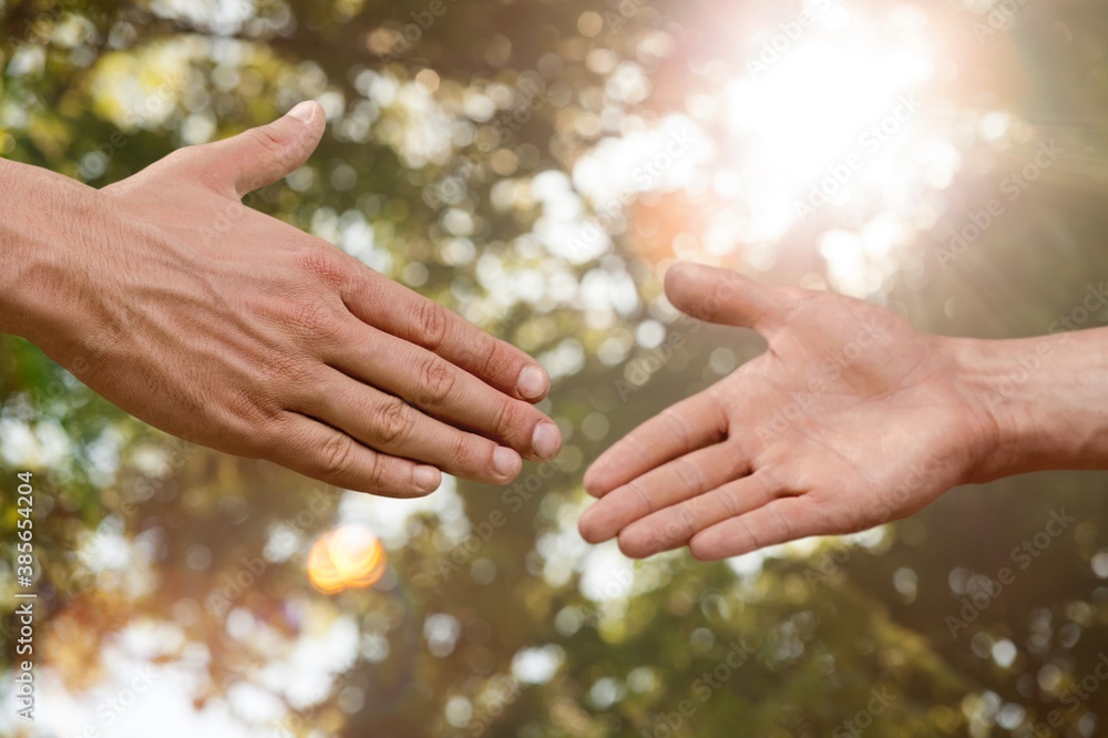 Business agreement handshake on blur background.