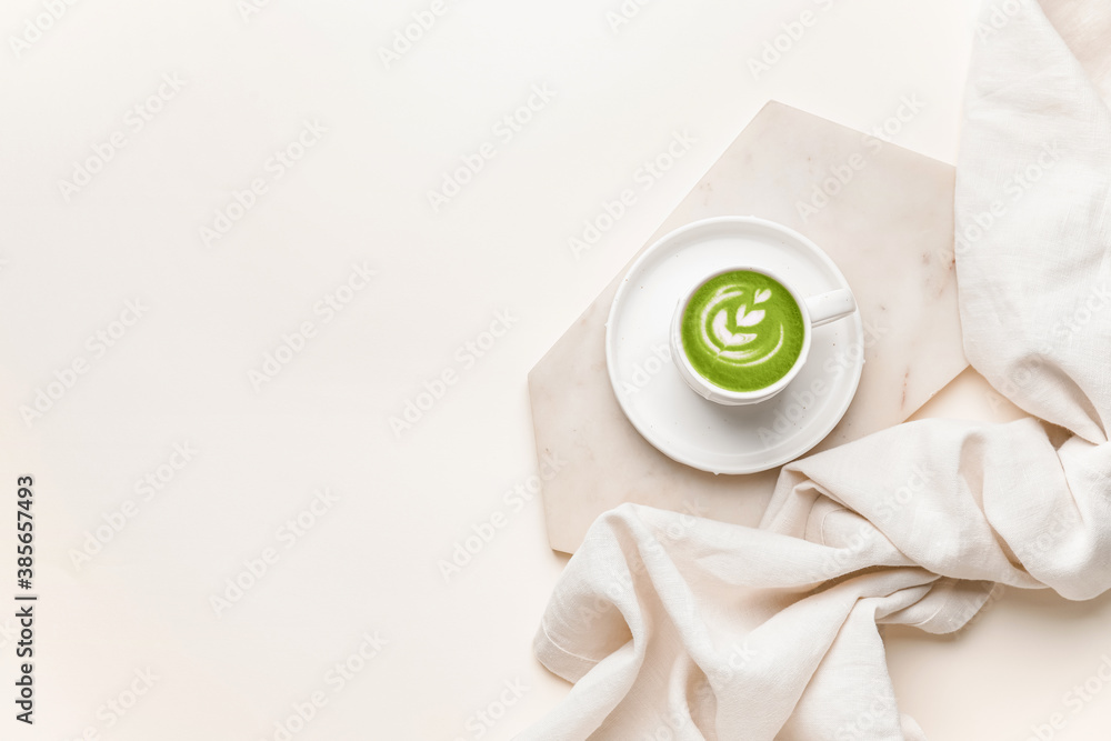 Cup of matcha tea on white background