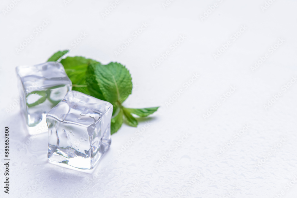 Ice cubes and mint on white background