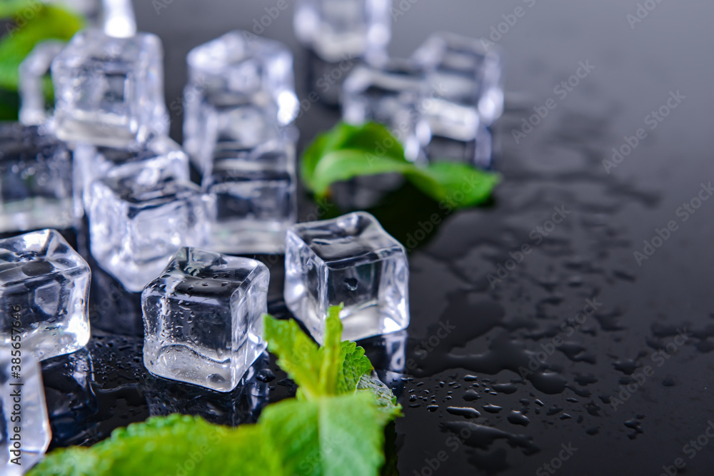 Ice cubes and mint on dark background