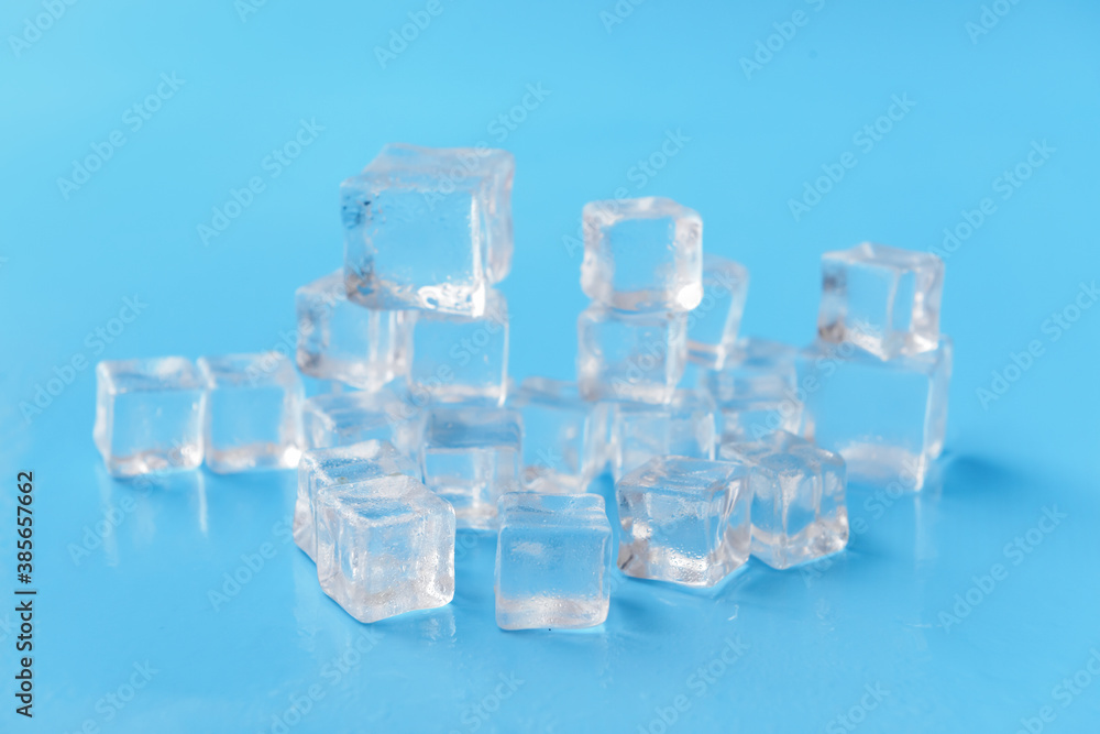 Ice cubes on color background